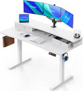 HUANUO 55″ x 26″ Electric Standing Desk with 2 Drawers, C-Clamp Mount Compatible, Height Adjustable Computer Desk, Home Office Stand Up Desk with 4 Preset Heights & 2 Hooks, White by HUANUO